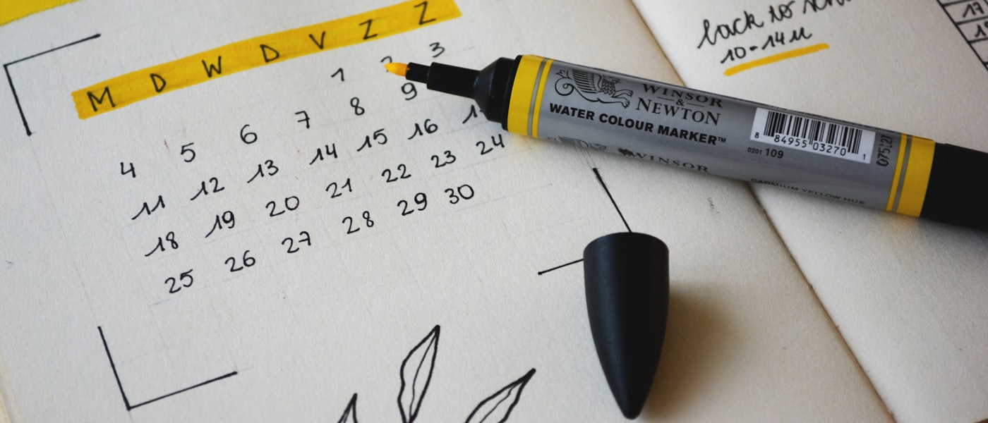 Wall calendar above a tidy desk — date and time calculators
