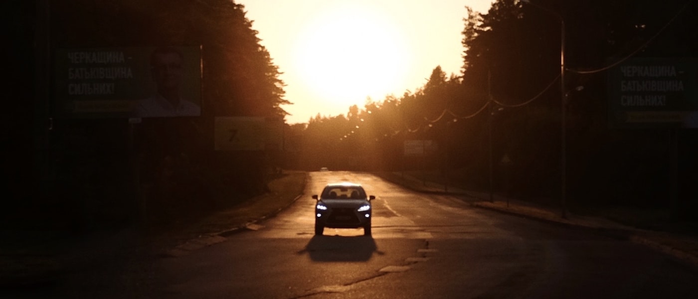 Car driving at sunset — vehicle and fuel calculators